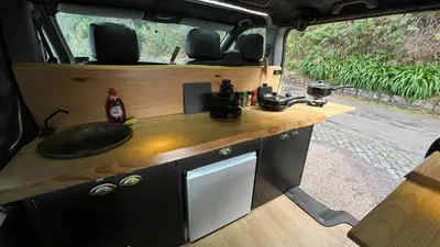 a table in the back of a camper van at Geko camper in Funchal