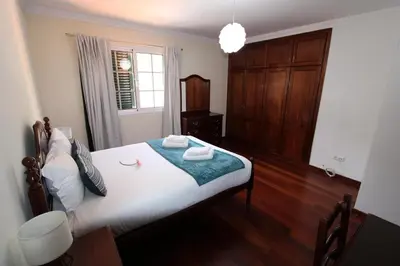 a bedroom with a bed and a large window at Amazing View in Santa Cruz
