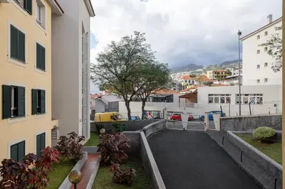 a view of a street between two buildings at Santiago House by An Island Apart in Funchal