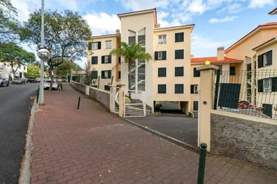 a street with buildings and a brick sidewalk at Santiago House by An Island Apart in Funchal