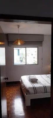 a room with a door leading to a room with a table at Funchal Lido Duplex in Funchal