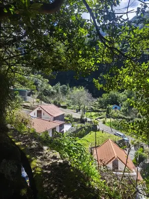 a view of a village through the trees at Portas da Levada A by Rent-a-key in São Vicente