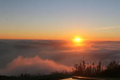 a view of the sun rising above the clouds at Madeira Native Motion Apartment in Ponta do Pargo