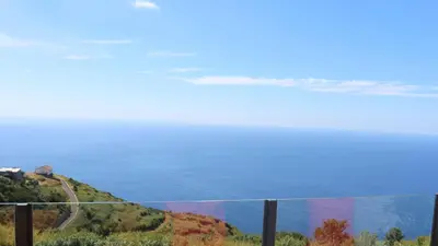 a sunset over the ocean with the sun in the sky at Madeira Native Motion Apartment in Ponta do Pargo