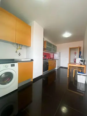 a kitchen with a washing machine in a kitchen at Amazing Views in Machico in Machico