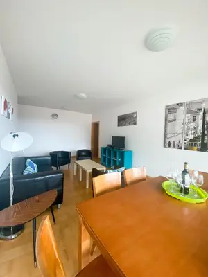 a living room with a table and a couch at Amazing Views in Machico in Machico