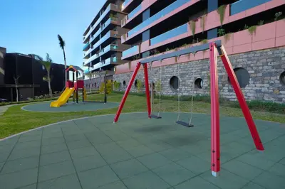 a playground with a swing set in a park at Diamond Ocean View by LovelyStay in Funchal