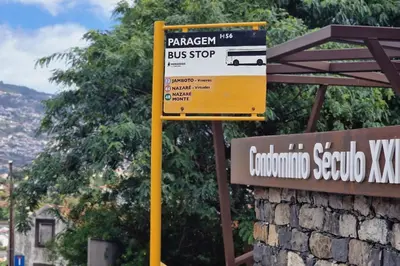 a bus stop sign in front of a sign at Diamond Ocean View by LovelyStay in Funchal