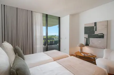 a bedroom with two beds and a window at Luxury in Funchal - Savoy Monumentalis II in Funchal