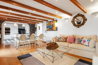 a living room with a couch and a table at Quinta da Fonte in Prazeres