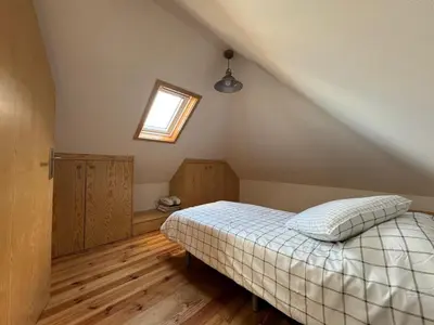 a bedroom with a bed in a attic at Jose CL in Estreito de Câmara de Lobos