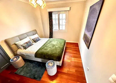 a small bedroom with a bed and a window at Villa Michelangelo in Câmara de Lobos