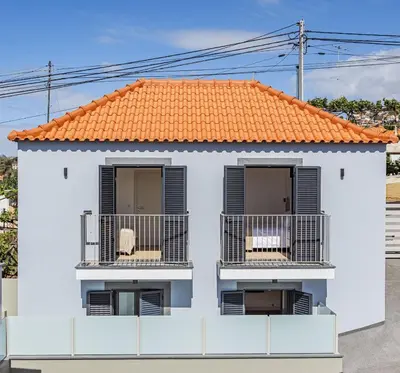 a view from the balcony of a house with a table at Cocoon House in Canhas