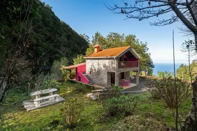 a house on the side of a mountain at A refuge in nature - Chalet D'Avó Teresa in São Vicente