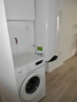 a white washer and dryer in a room at Holiday apartments Funchal - Rosemary in Funchal