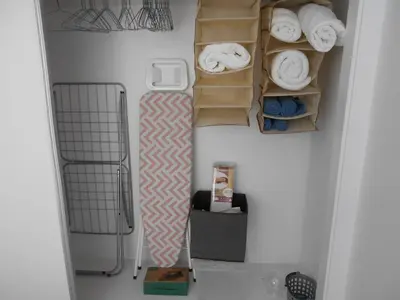 a bathroom with towels and boxes on the wall at Holiday apartments Funchal - Rosemary in Funchal