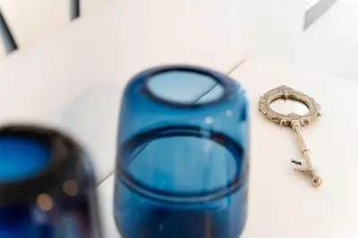 a blue pair of scissors sitting on a table at GuestReady - Scenic Retreat with Stunning Views in São Vicente