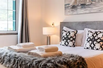 a bedroom with a bed with two towels on it at GuestReady - Scenic Retreat with Stunning Views in São Vicente