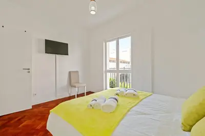 a bedroom with a bed with white towels on it at Quinta Paraiso in Funchal