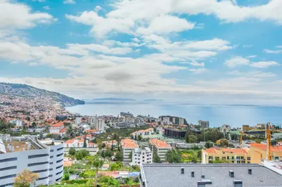 a view of a city and the water at Best View Funchal Vacation Apartment in Funchal