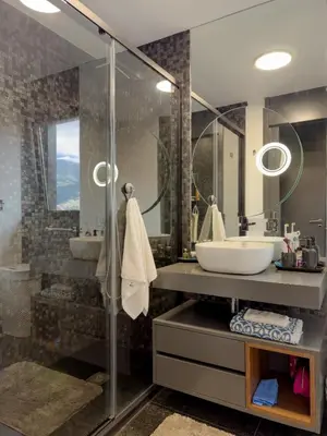a bathroom with a sink and a glass shower at Best View Funchal Vacation Apartment in Funchal