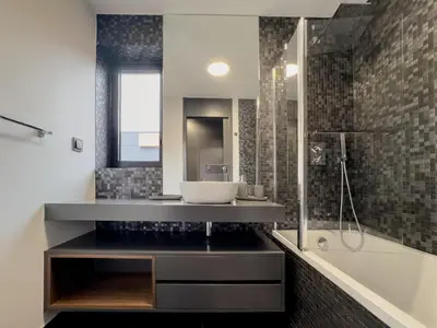a bathroom with a sink and a shower and a tub at Best View Funchal Vacation Apartment in Funchal