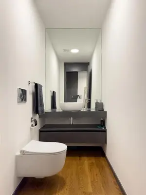 a bathroom with a white toilet and a sink at Best View Funchal Vacation Apartment in Funchal