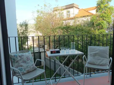 two chairs and a table on a balcony at Alamos Charming Apartments - Family in Funchal