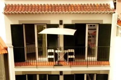a living room with a couch and a table at Alamos Charming Apartment - View in Funchal