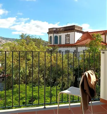 a kitchen with a sink and a refrigerator at Alamos Charming Apartment - View in Funchal