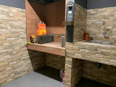 a kitchen with a counter with a sink at Amélia's House in Seixal