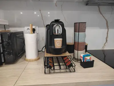 a black coffee maker sitting on top of a counter at Casa da Cristina in Santa Cruz