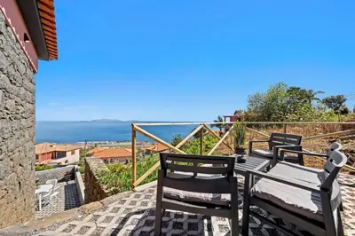 a view of the ocean from the balcony of a house at Casa da Cristina in Santa Cruz