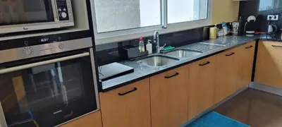 a kitchen with a sink and a microwave at VillaMadeira - Apartments in Funchal in Funchal