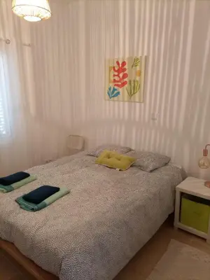 a bedroom with a bed with two pillows on it at Vivenda Nina in Porto Santo