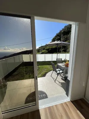 a sliding glass door with a view of a patio at Filipe's Green Landscape in Tábua