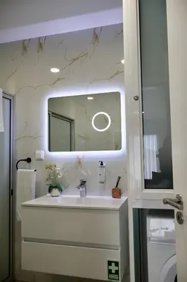 a bathroom with a sink and a mirror at Filipe's Green Landscape in Tábua