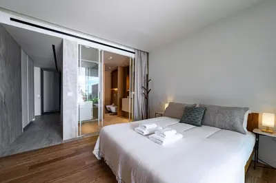 a bedroom with a large white bed in a room at Savoy Residence Monumentalis 2B or Not 2B by LM&AC Signature in Funchal