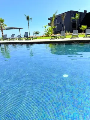 a swimming pool with chairs and a swimming pool at Virtudes Charm in Funchal