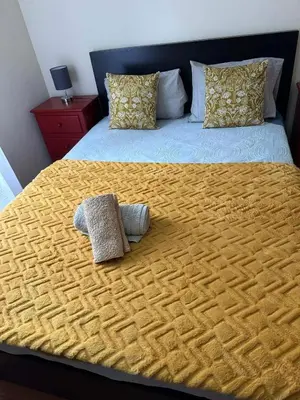 a large bed with two pillows on top of it at Sea View Andrade 3 Bedroom House in Gaula