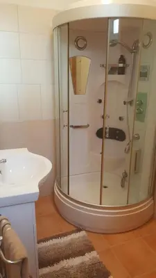 a bathroom with a shower and a sink at Funchal - Breathtaking ocean & city view house in Funchal