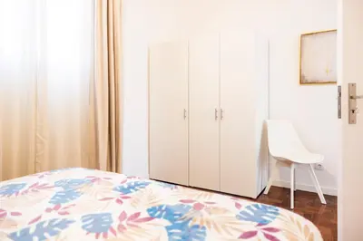 a bedroom with a bed and a white cabinet at Porto Santo Beach Side Oasis in Vila Baleira
