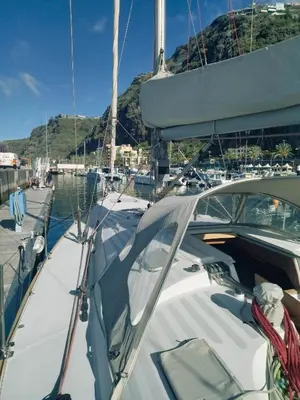 a boat is docked in a marina at Timeresci in Calheta