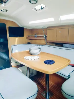 a wooden table in the middle of a boat at Timeresci in Calheta