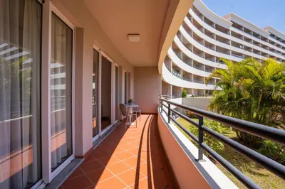 a balcony with a view of a building at NÔNA Suite Funchal in Funchal