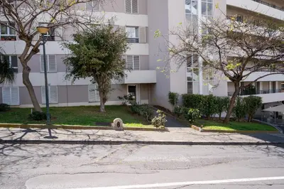 an empty street in front of a building at NÔNA Suite Funchal in Funchal