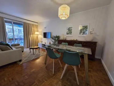 a living room with a dining table and chairs at The Infante Stay in Funchal