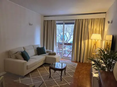 a living room with a couch and a table at The Infante Stay in Funchal