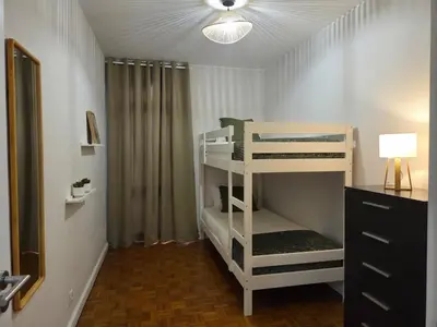 a room with two bunk beds and a lamp at The Infante Stay in Funchal