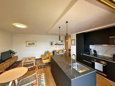a kitchen and living room with a counter top at Colours by Madeira Best Apartments in Funchal